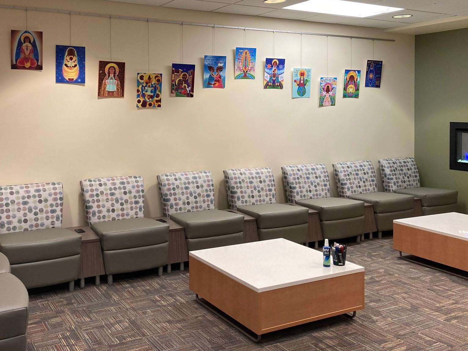 Picture of Madonnas of Color paintings displayed in the library entrance area