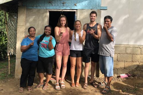 Levi Orr and Jordyn Keyes are pictured with hosts for their week in a small Filipino village during their monthlong internship.