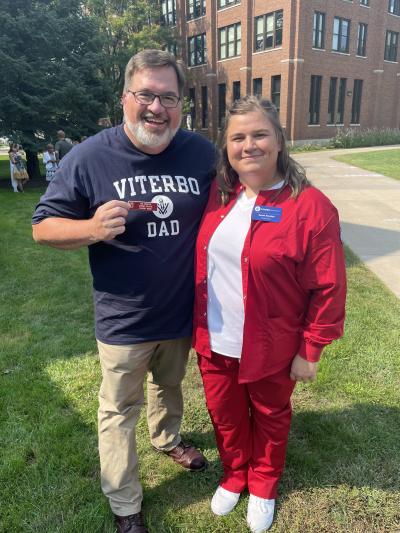 Alumnus Dan Kinstler and his daughter, nursing student Sarah Kintsler. Dan is holding his original Viterbo College Student Nurse name tag.