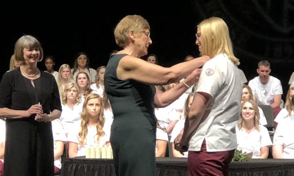 Vickie (Bjork) Mousel had the honor of taking part in the pinning ceremony of her daughter, Greta, in May 2019, on same stage where she had graduated from nursing school in 1978.