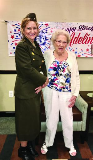 At Adeline (Berg) Blundy’s 100th birthday celebration, her granddaughter, Jeanie, wore Blundy’s World War II service uniform as a surprise.
