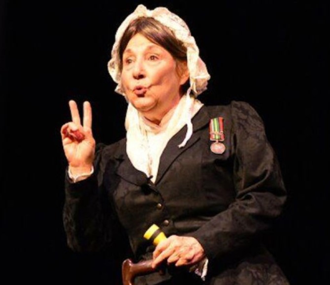 Image of Dr. Candy Campbell dressed like Florence Nightingale in historical clothing.