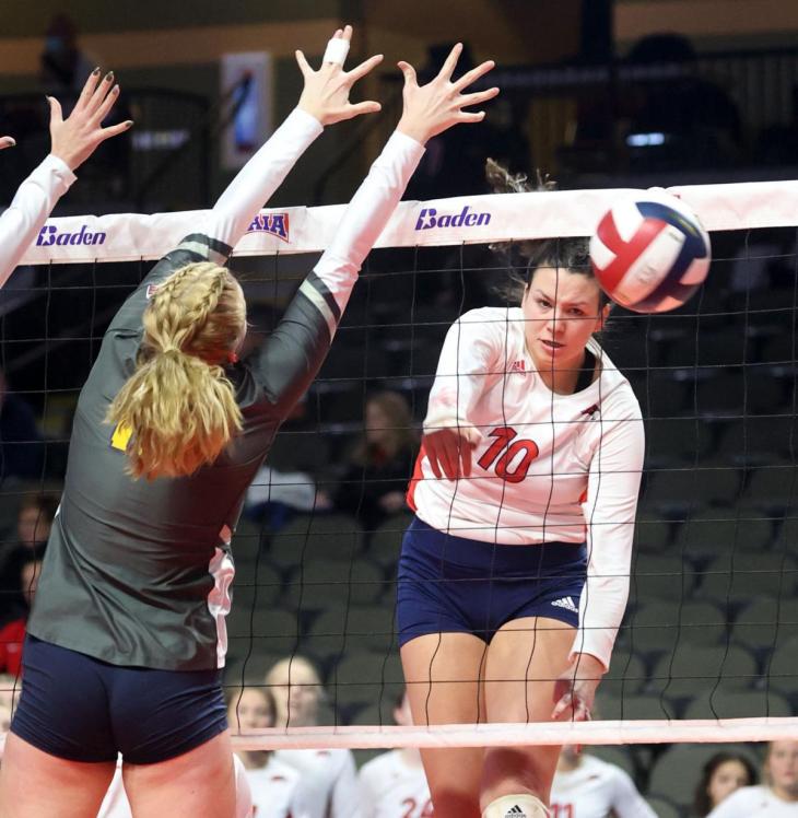Viterbo's Miah Garant turns an attack away from a block by Oregon Tech's Kate Hicks during the second set of Tuesday's NAIA National Volleyball Tournament pool-play match in Sioux City, Iowa. Viterbo won by set scores of 22-25, 32-30, 26-24, 22-25 and 15-13 to start out 1-0 in pool play. There are eight pools of three teams, with only one team per pool able to advance to Thursday’s quarterfinals. (Nate Beier photo)
