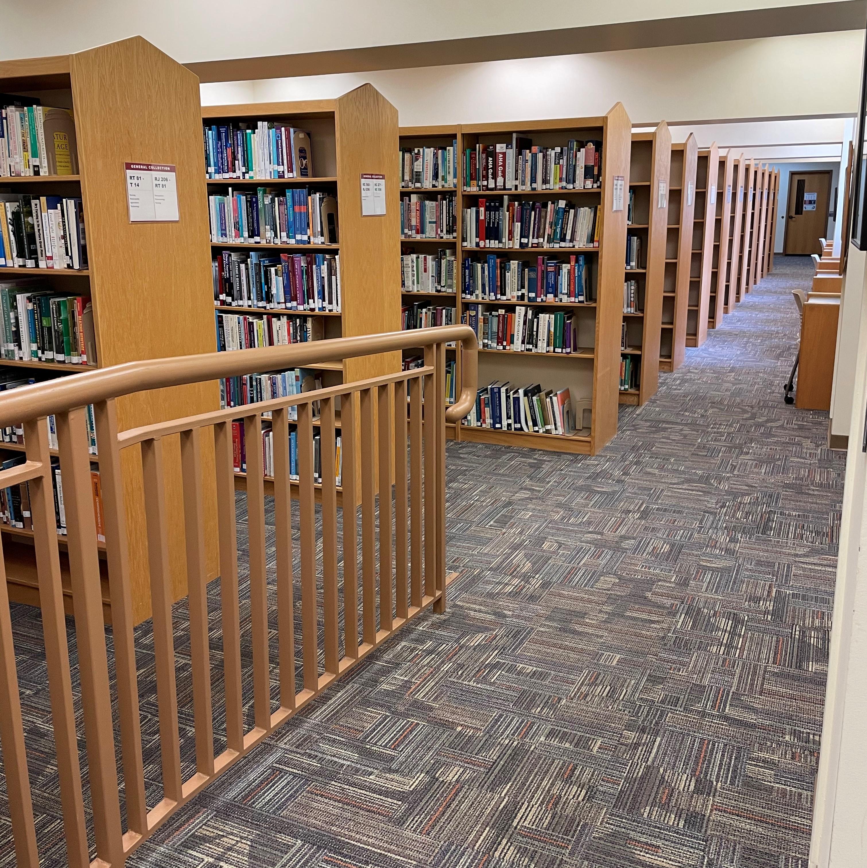 Photo of library book stacks.