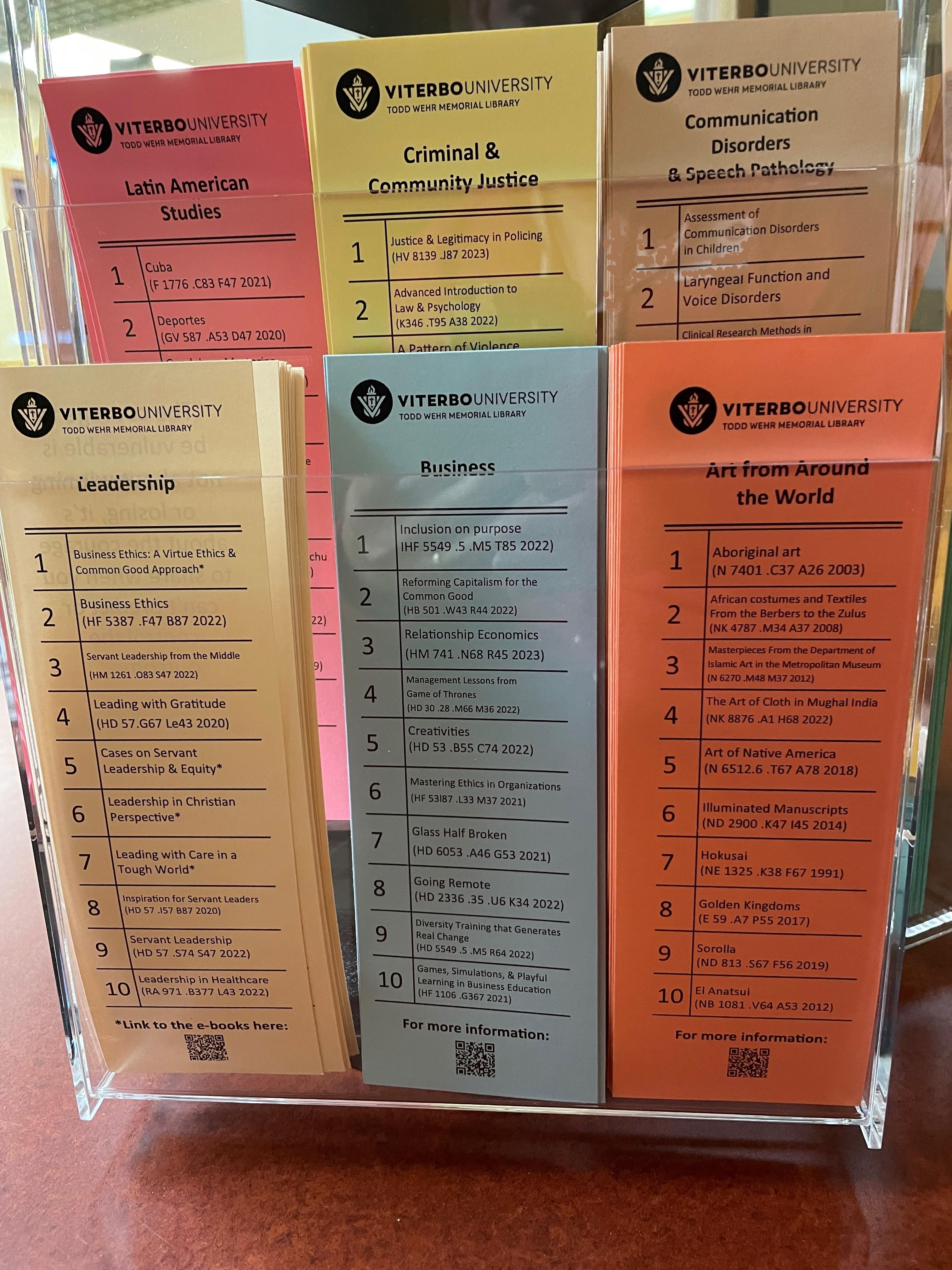 Photo of several of the new subject-based library bookmarks in their stand.