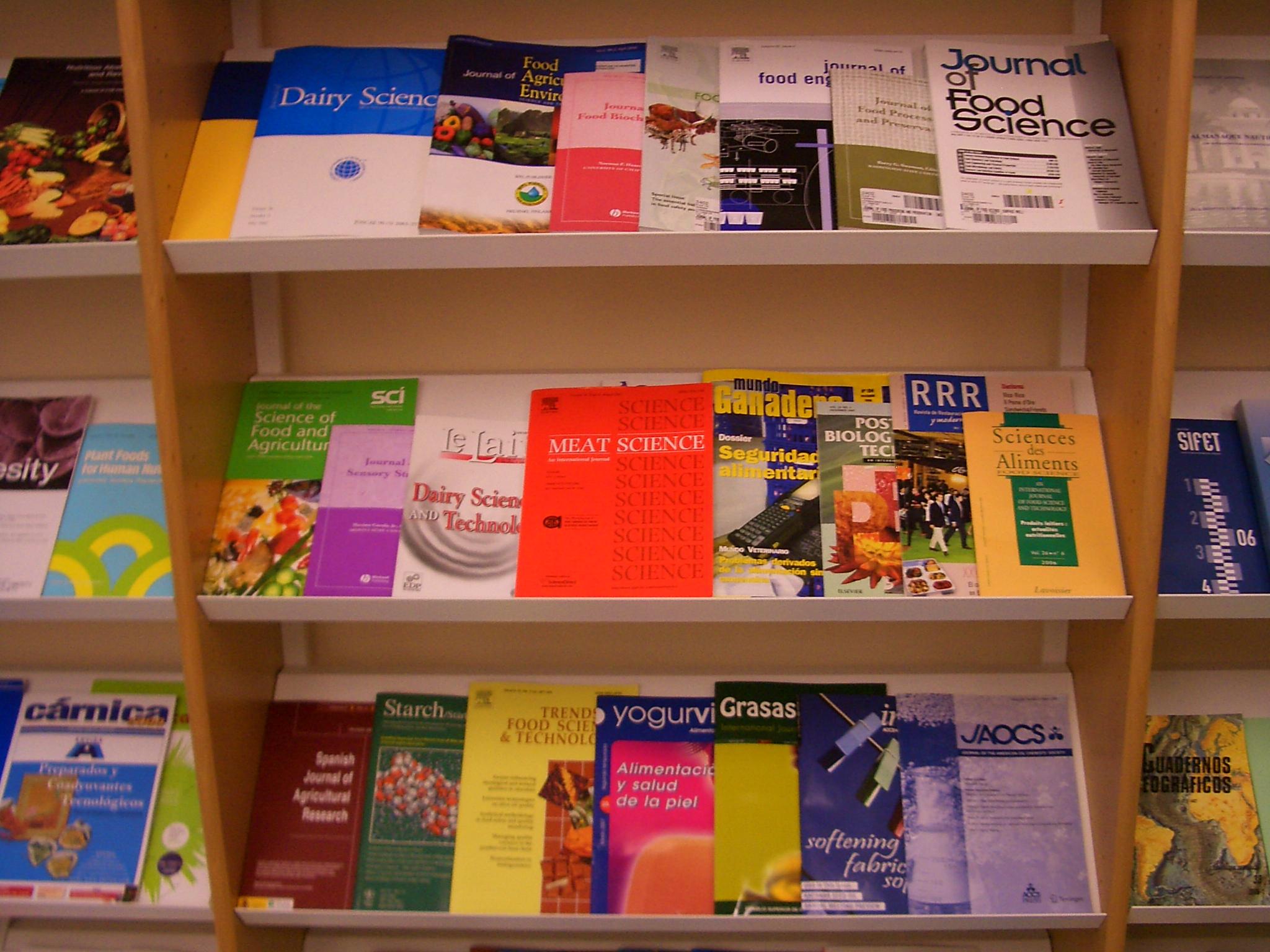 Academic journals on library shelves