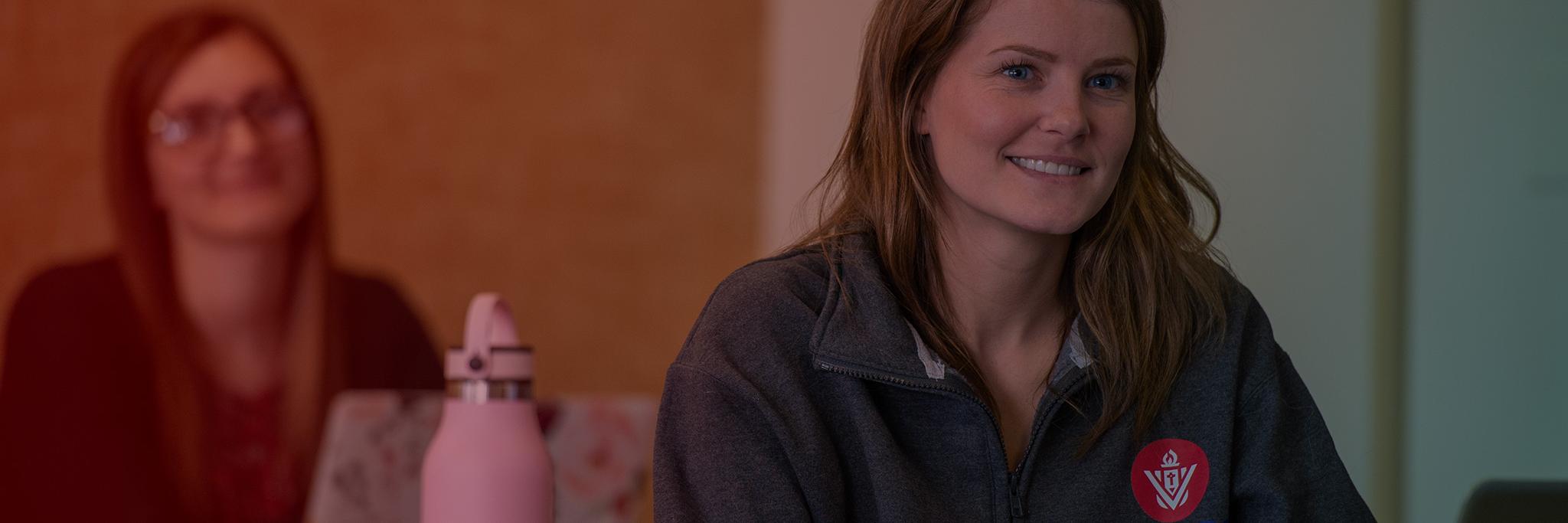 Young Viterbo female student smiling in classroom