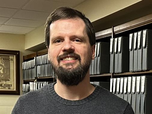 Jason Skoog in the Viterbo University archives room