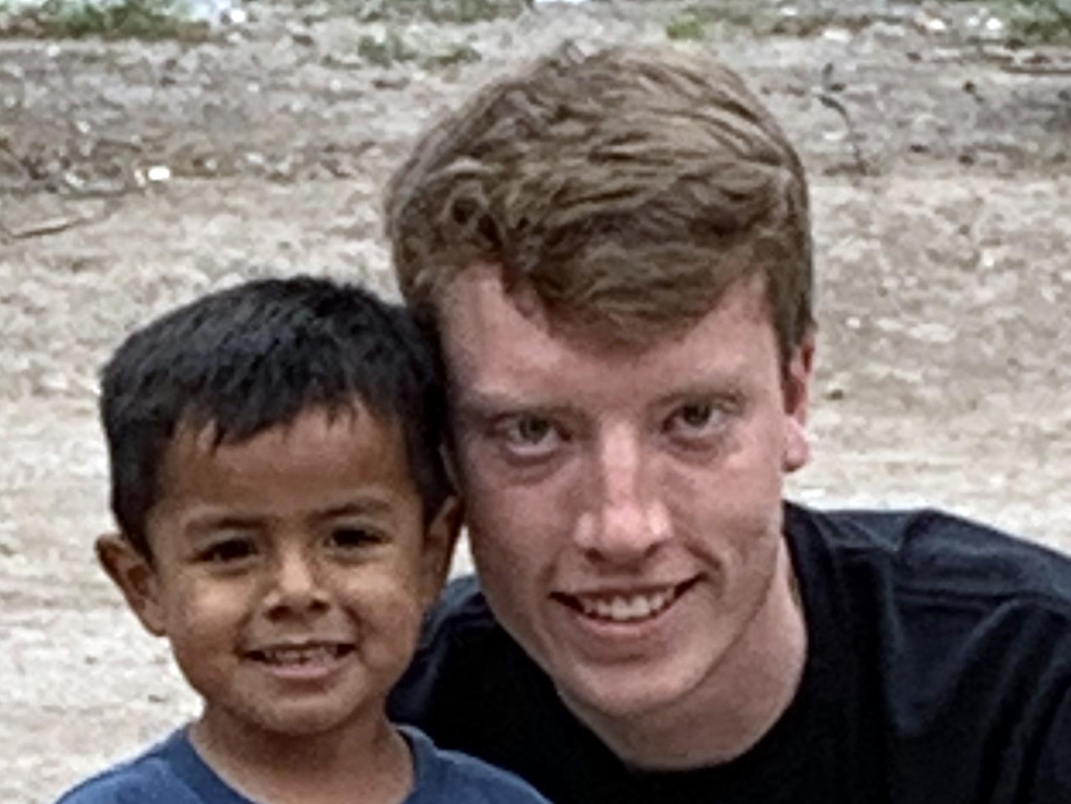 Ben Gibson and a new friend during service immersion trip
