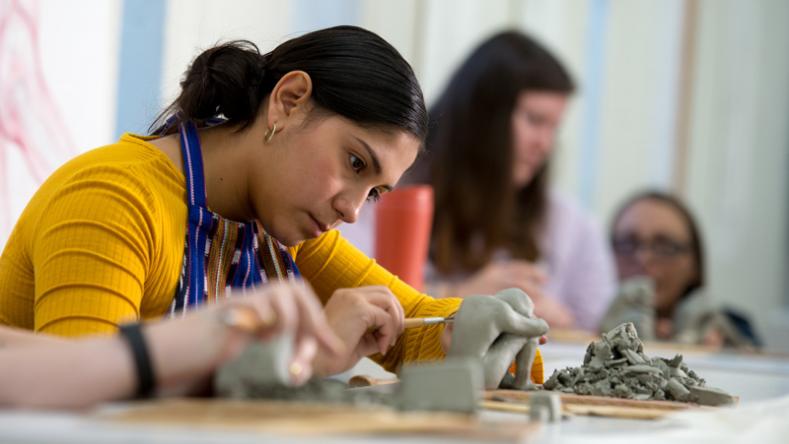 Student sculpting in class