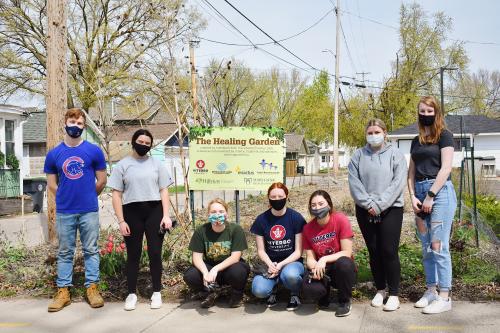 Service group in front of The Healing Garden