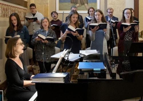 Polly Pappadopoulos accompanies the St. Francis choir.