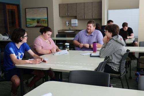 Taylor Hanson, a faculty member in Viterbo's Dahl School of Business who has earned two degrees at Viterbo, teaches a class on college success for members of the Boys & Girls Clubs of Greater La Crosse. The class is part of the Pathways program, which started four years ago.