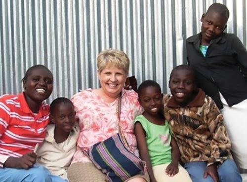 Denise Runge with young friends in Nairobi, Kenya