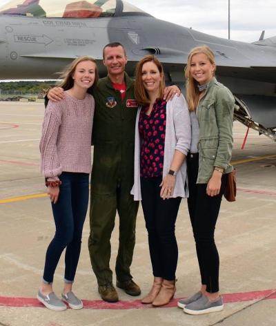 Chad Milne is pictured after his final F-16 flight with his family.