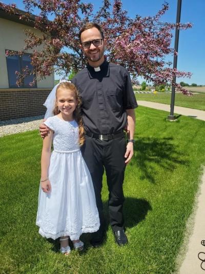 Father Michael Churchill with girl