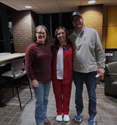 Raina Nava with her parents.jpg