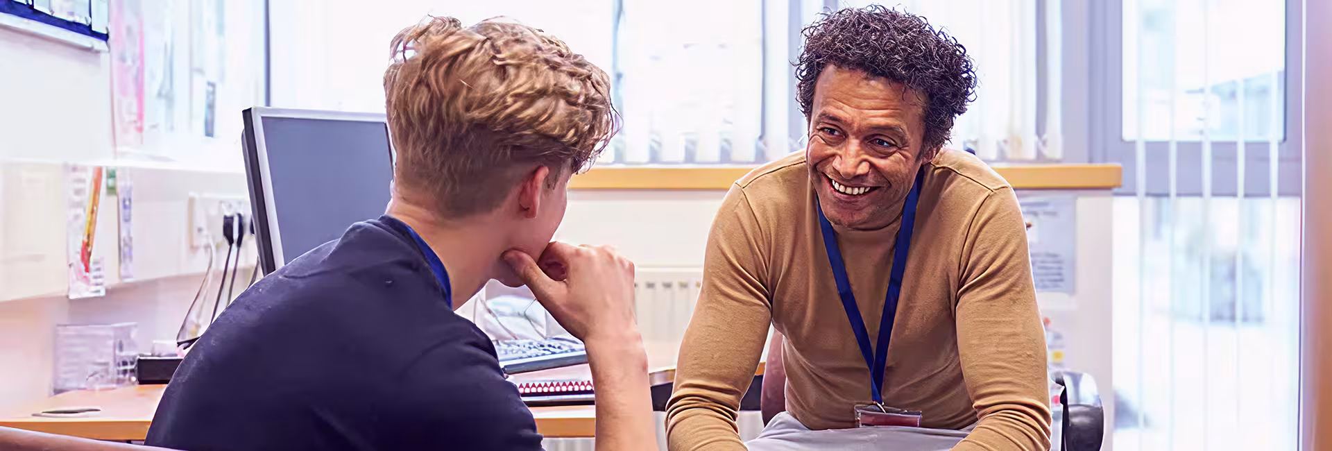 Professor talking to student