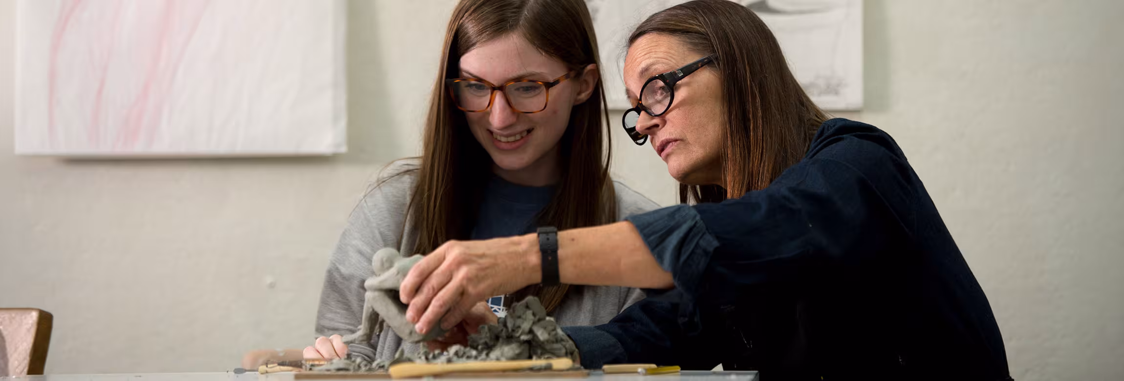 Student with art instructor