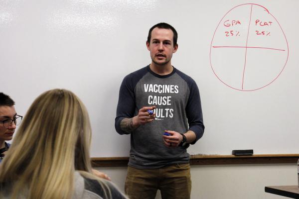 Adam Zart, a 2012 Viterbo graduate, talks to a group of students about his educational and professional journey on the Viterbo campus.