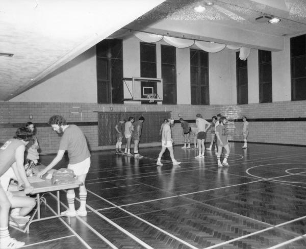 A basketball game in the  Murphy gymnasium.